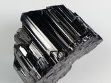 an image of a piece of black quartz on a white background