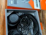 a box of headphones sitting on a wooden table