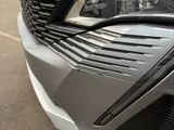 a close up of the front of a car with a grill
