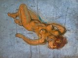 un tableau représentant une femme nue allongée sur le sol