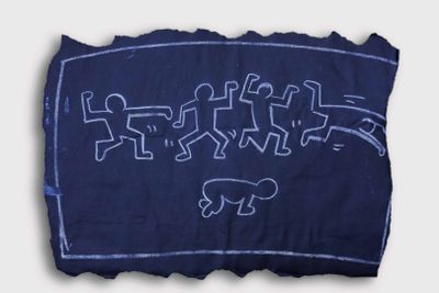 an image of a piece of cloth with a drawing of people on it