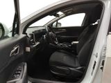 the interior of a car with the door open and the driver ' s seat down