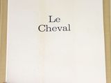 someone is holding a book with the words le cheval on it
