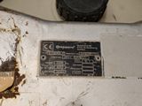 a dirty machine that is sitting on the floor