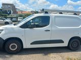 a white van that is parked in a parking lot