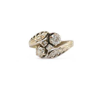 a close up of a gold ring with diamonds on it