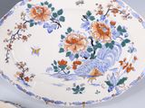 a plate with flowers on it sitting on a table