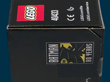 lego batman figure in a black box on a blue background