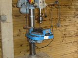 a blue machine that is sitting in a room