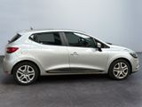 the silver car is parked in a room with a gray floor
