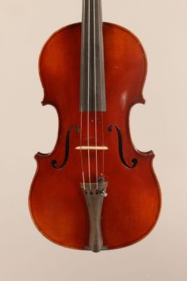 an old violin with a bow hanging from it ' s neck