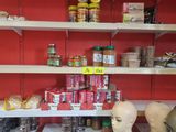 many shelves with various items on them in a store
