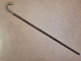 a long metal pole with a handle on a table