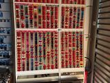 many cans of soda stacked on the shelves in the store