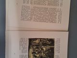 an open book with a picture of a man and a woman sitting on a bench