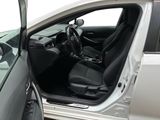 the interior of a car with the door open and the driver ' s seat down
