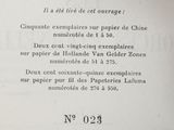 a close up of an open book with a picture of a clock on it