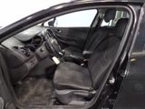 the interior of a car with the door open and the driver ' s seat down