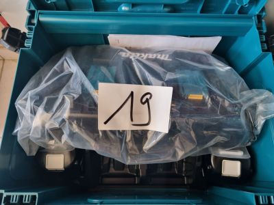 a plastic container with a plastic sign on it