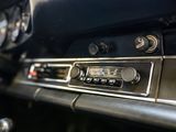 a close up of a car ' s dashboard with a clock