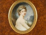 a painting of a woman in a white dress and a brown frame