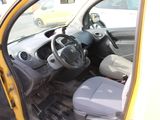 a small yellow car with a steering wheel and dashboard