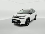 a white car is parked in a white room with a white floor