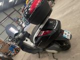 a scooter that is parked in a garage