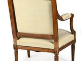 an image of a pair of chairs with a beige upholstered seat