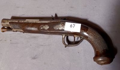 a gun with a tag on it on a table