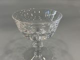 a small glass bowl on a table with a white background