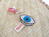 a straw basket with a pair of eye glasses and a lollipop