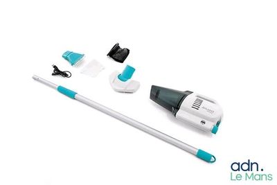 a close up of a mop and cleaning kit on a white surface