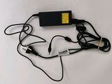 a picture of a laptop and a charger on a table