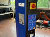 a blue machine that is sitting in a room