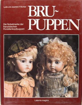 an image of a book with a picture of two dolls on it