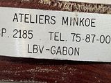 a label on a piece of wood that says ateliers minkje