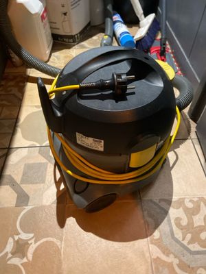 an image of a vacuum cleaner on the floor of a kitchen