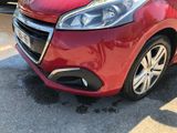 a red car that is parked in the parking lot