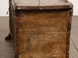 an old wooden box sitting on the floor in a room