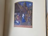 an open book with a picture of a nativity scene on it