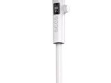 a close up of a fan on a stand with a remote control