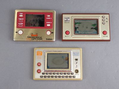 three electronic devices that are sitting on a table