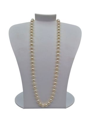 a close up of a necklace on a mannequin with a white background