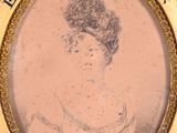 an old picture of a woman in a dress in a gold frame