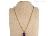 necklace with amethe stone and gold chain on mannequin