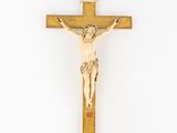 a wooden crucif with jesus on the cross on a white background
