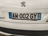 a close up of a car ' s license plate on the back of a car