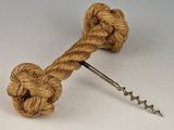 a corkscue with a knot on it and a corkscue with a corkscue attached to it
