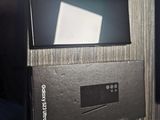 a box that has a remote in it on top of a table
